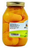 Back label of Great Lakes Preserves Peach Halves jar showing ingredients list and barcode under gold lid.