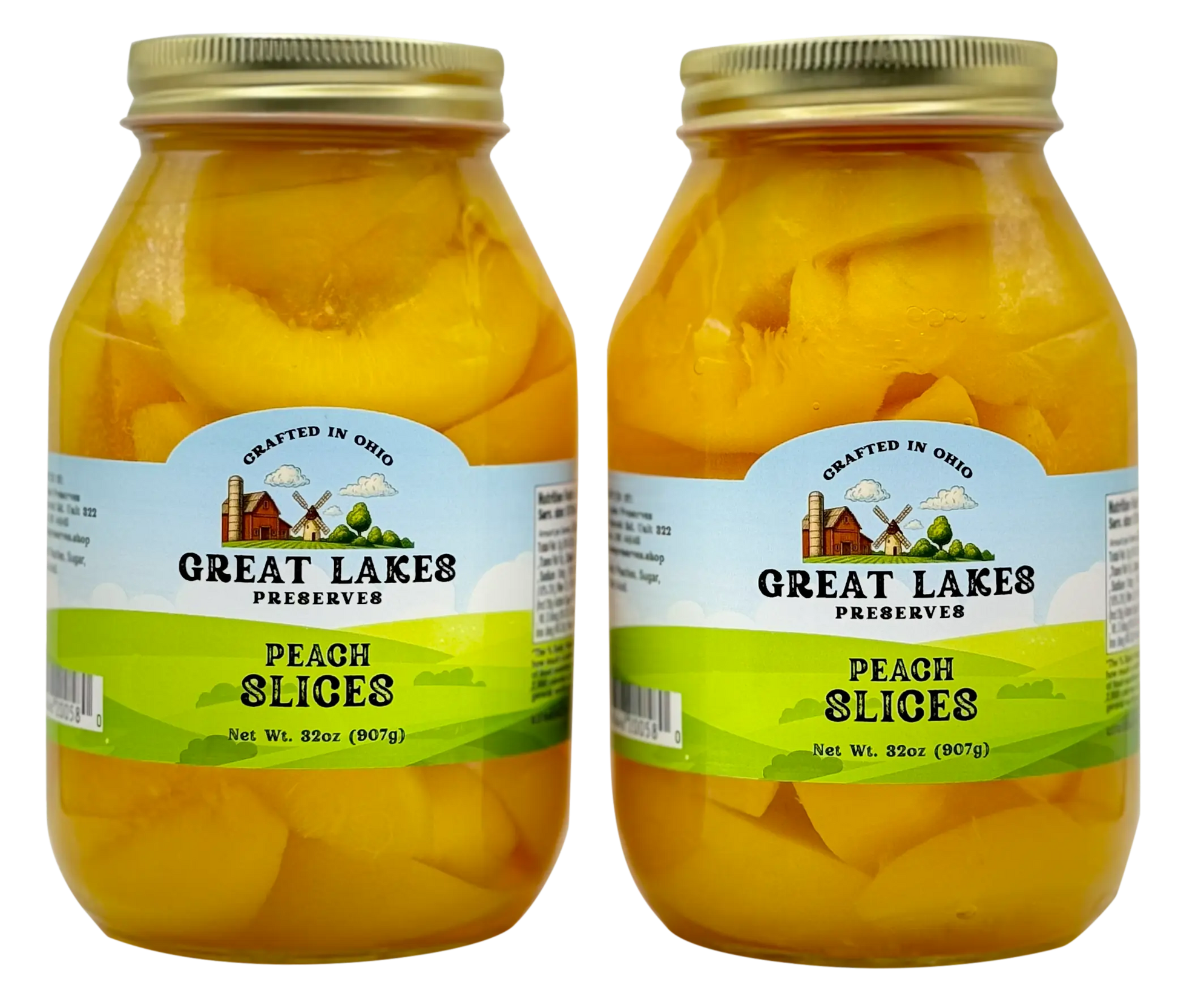 Two Great Lakes Preserves Peach Slices jars, 32 oz (907g) each, front labels facing with gold lids.