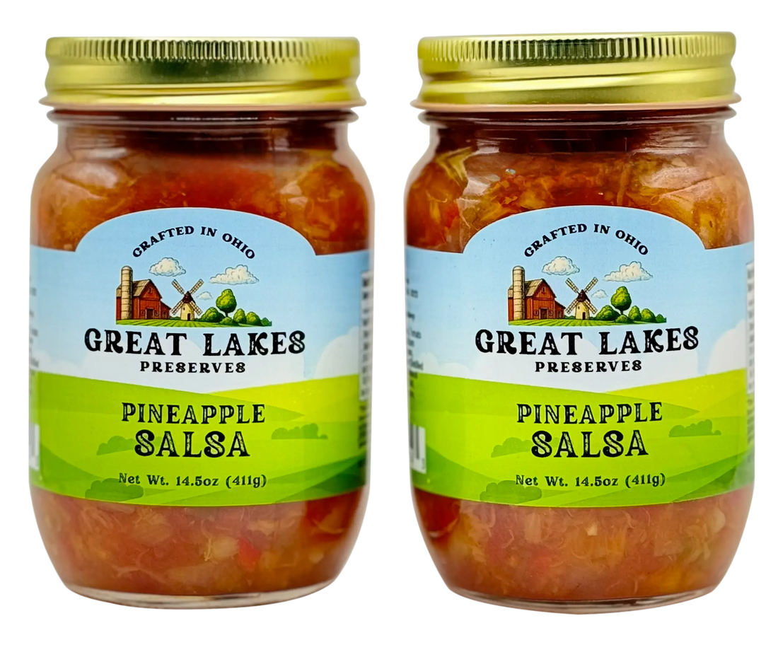 Two Great Lakes Preserves Pineapple Salsa jars, 14.5 oz (411g) each, front labels facing with gold lids.