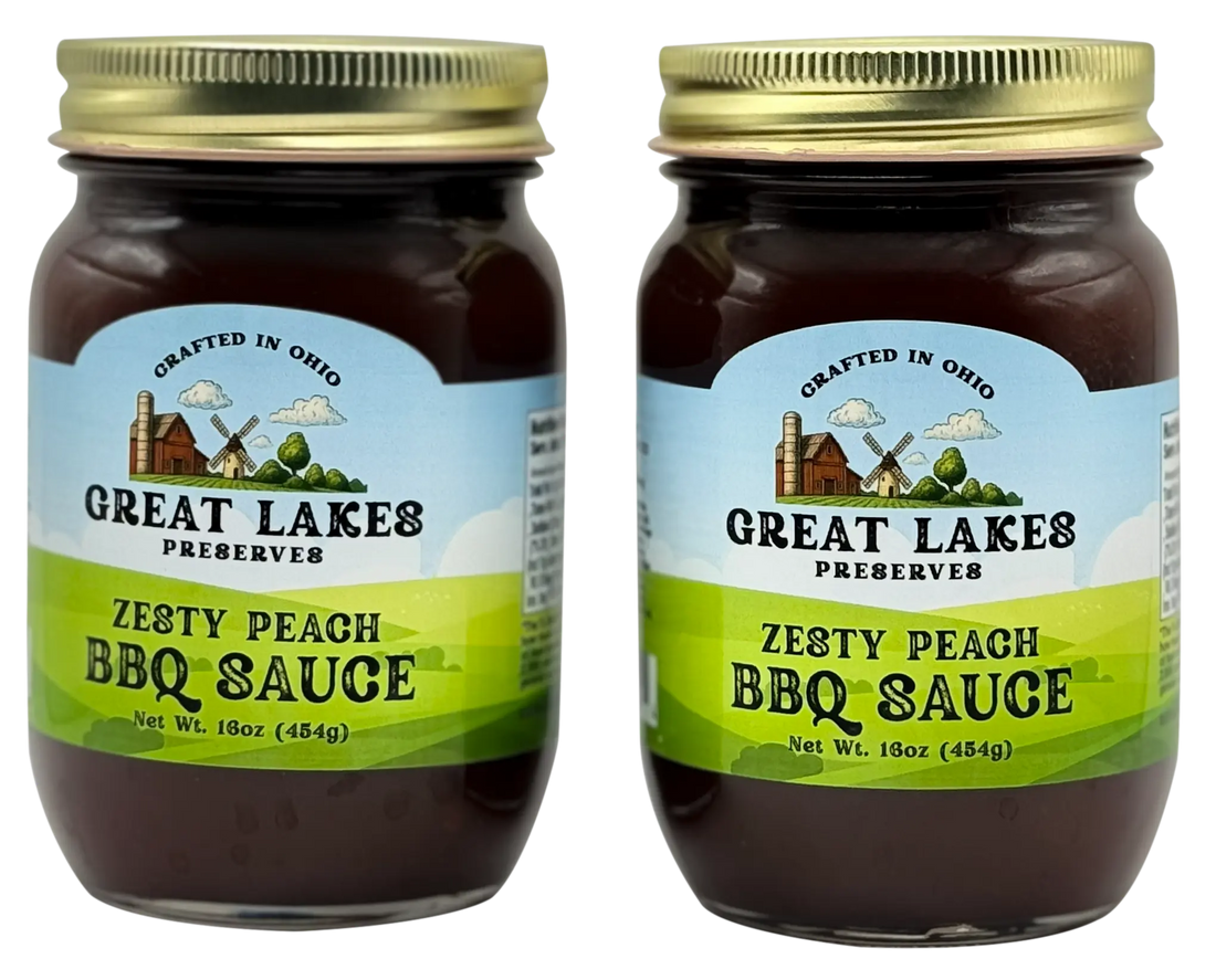 Two Great Lakes Preserves Zesty Peach BBQ Sauce jars, 16 oz (454g) each, front labels shown with gold lids.